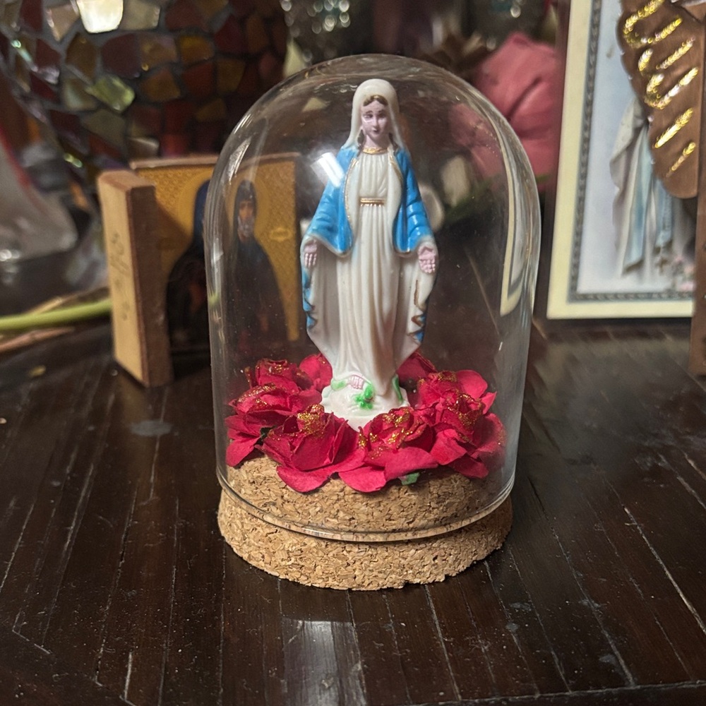 Blessed mother under cloche dome with Red roses